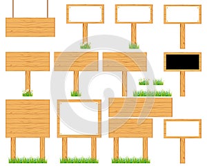 Wooden realistic display signboards standing on the grass or . photo