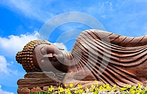 Wooden reclining Buddha statue.