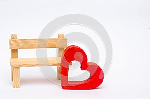 Wooden red heart and bench on a white background. Valentine`s Da