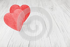 Wooden red hearts on white background