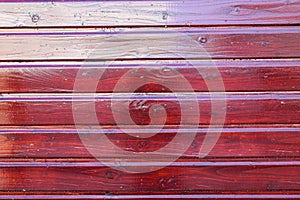 Wooden red horizontal wall facade fence made of planks wood burgundy vertical background