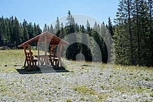 Wooden refuge on a mountain road to  Pietrele Doamnei mountain Lady`s stones cliff. Rarau mountains in Bucovina,  Romania