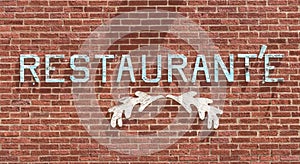 A wooden Restaurant\'e sign on a brick wall in Sheffield, Pennsylvania, USA