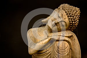 Wooden resting buddha carving