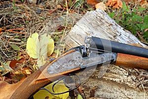 A wooden retro shotgun in autumn