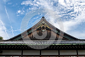 Wooden, richly decorated Nijo Castle roof in Kyoto, with golden ornaments, Japan.