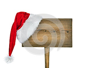 Wooden road sign with Santa hat