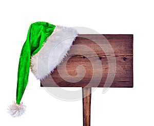 Wooden road sign with Santa hat