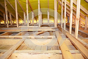 Wooden Roof Beams, Rafters, Trusses,  Frame House Attic Insulation Construction.  Roofing Construction Attic Interior