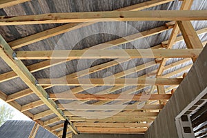 Wooden roof construction. house building. Installation of wooden beams at construction