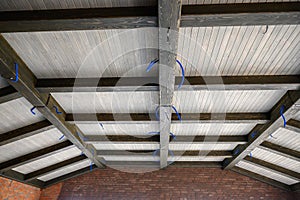 Wooden roof structure inside new house under construction, loft style design