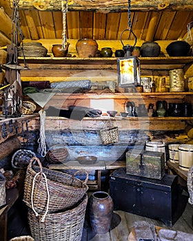 Wooden room filled with ancient household items. room of Antiques.