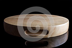 Wooden round cutting board from side