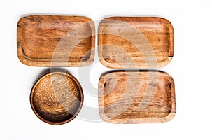 Wooden round and rectangular eco-friendly bowls on white background