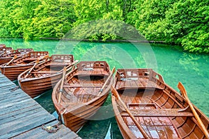 Wooden rowboats available for hire on a lake in Croatia.