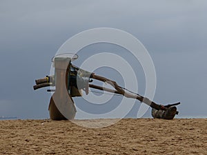 Wooden rowing boat on the shore on gloomy day