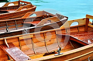 Wooden rowing boats on a wooden pier.Boats on the lake at morning