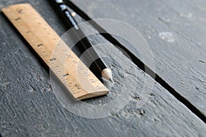 Wooden ruler lies on a vintage table
