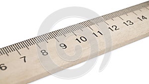 Wooden ruler with measuring length markings in centimeters isolated on white