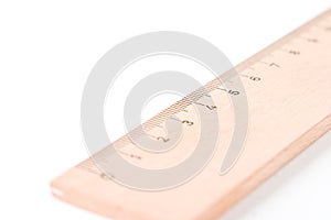 A wooden ruler with a white ba