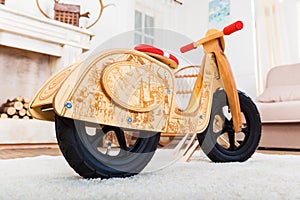 Wooden runbike in the living room at home