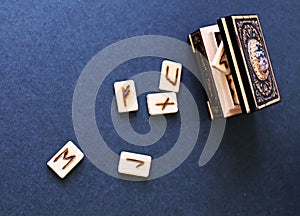 Wooden runes in casket