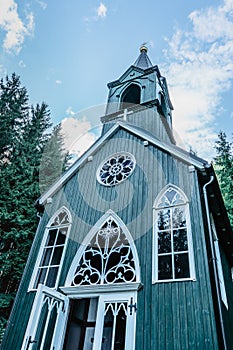 Wooden rural chapel called Tichackova kaple in Broumovsko region,Czech republic.Catholic church in spring countryside.Religious