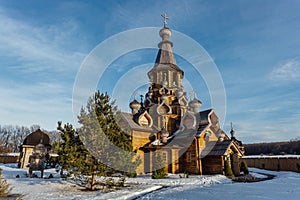 Wooden Russian church in sunny winter day