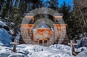 Wooden Russian orthodox chapel dedicated to Saint Vladimir on a sunny winter day