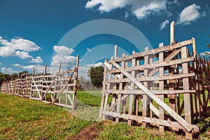 Wooden rustic fence and blue sky