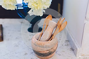 Wooden rustic and vintage crockery, tableware, utensils and stuff on wooden table-top. Kitchen still life as background
