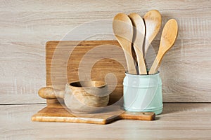 Wooden rustic and vintage crockery, tableware, utensils and stuff on wooden table-top. Kitchen still life as background for design