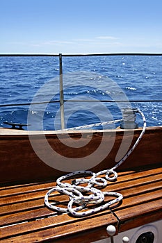 Wooden sailboat boat deck blue sky ocean sea