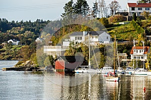 Wooden sailboats stand at the dock