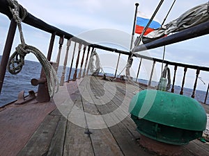Wooden sailing ship is on the sea. Details and close-up. Sunny weather