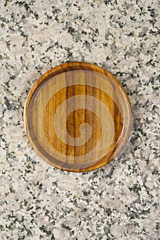 wooden saucer on granite stone