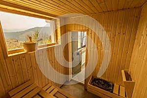 Wooden sauna with seats. Accessories interior of sauna spa