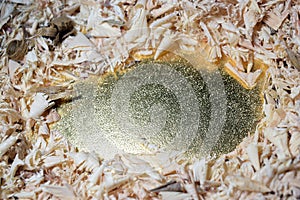 Wooden saw dust on golden paper