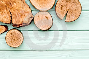 Wooden sawcut background for blog on mint green top view mockup