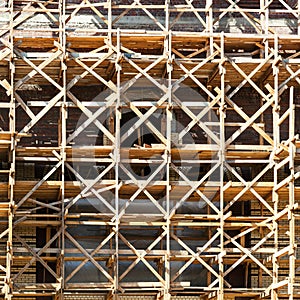 wooden scaffolding on multi-storey building