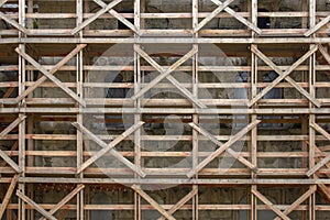 Wooden scaffolding during the restoration of an ancient stone cathedral