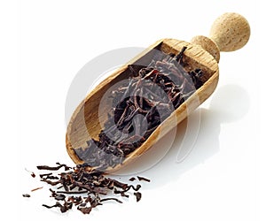 Wooden scoop with black Ceylon tea