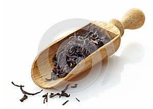 Wooden scoop with black tea Assam