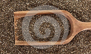 Wooden Scoop In Chia Seeds