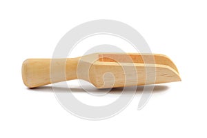 Wooden scoop close up on white background photo