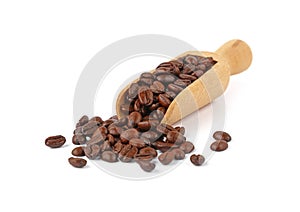 Wooden scoop of roasted coffee beans on white