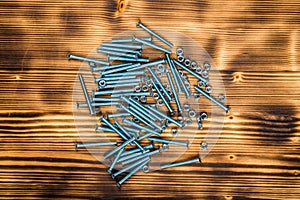 Wooden screws on burnt wooden desk