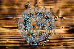 Wooden screws on burnt wooden desk