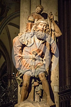 Wooden sculpture of Saint Christopher carrying young Jesus in Colgone Cathedral