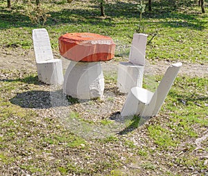 Wooden sculpture of table-mushroom and chairs